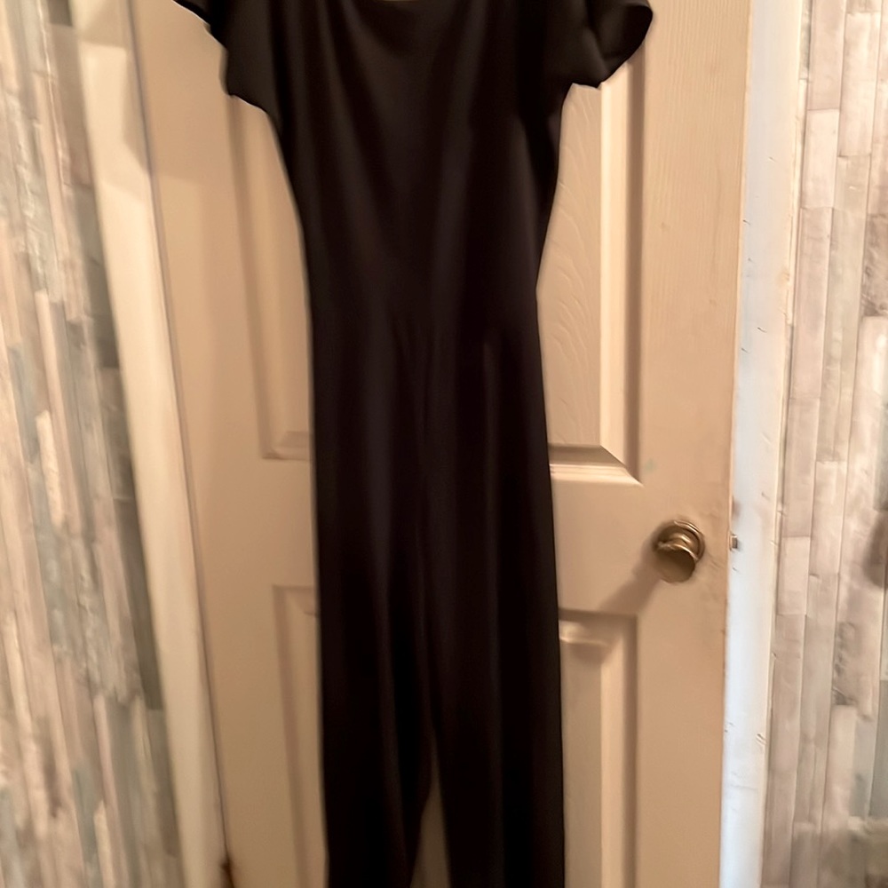 Ladies Black jumpsuit with the back out in a crisscross style, never worn